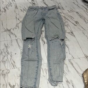 Woman’s  Distressed Blue Jeans